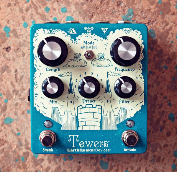 Blue and white Towers pedal on brass background.