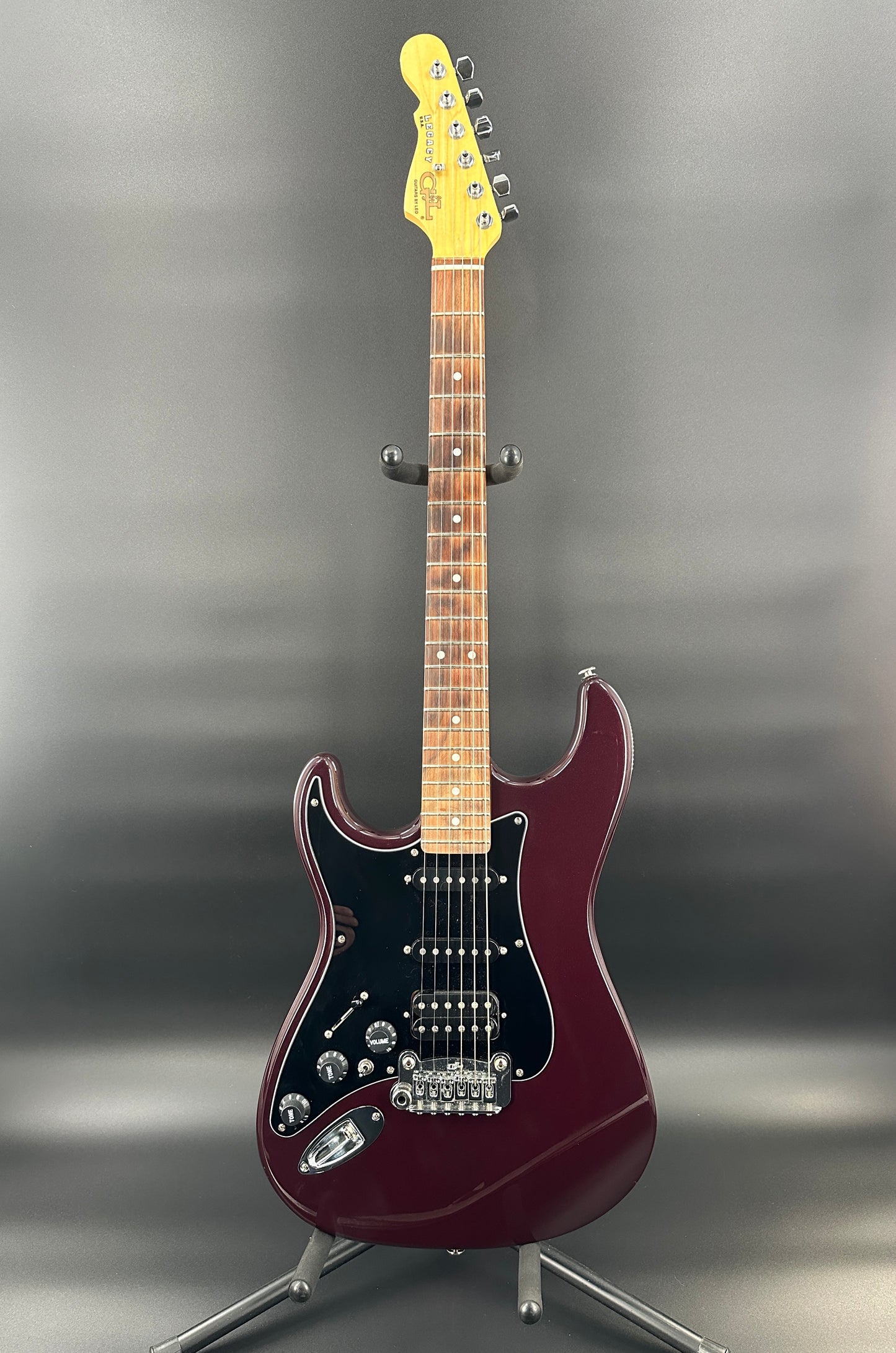 Full front shot of Used G&L Legacy USA Fullerton Deluxe HSS Ruby Red Metallic Left Handed.