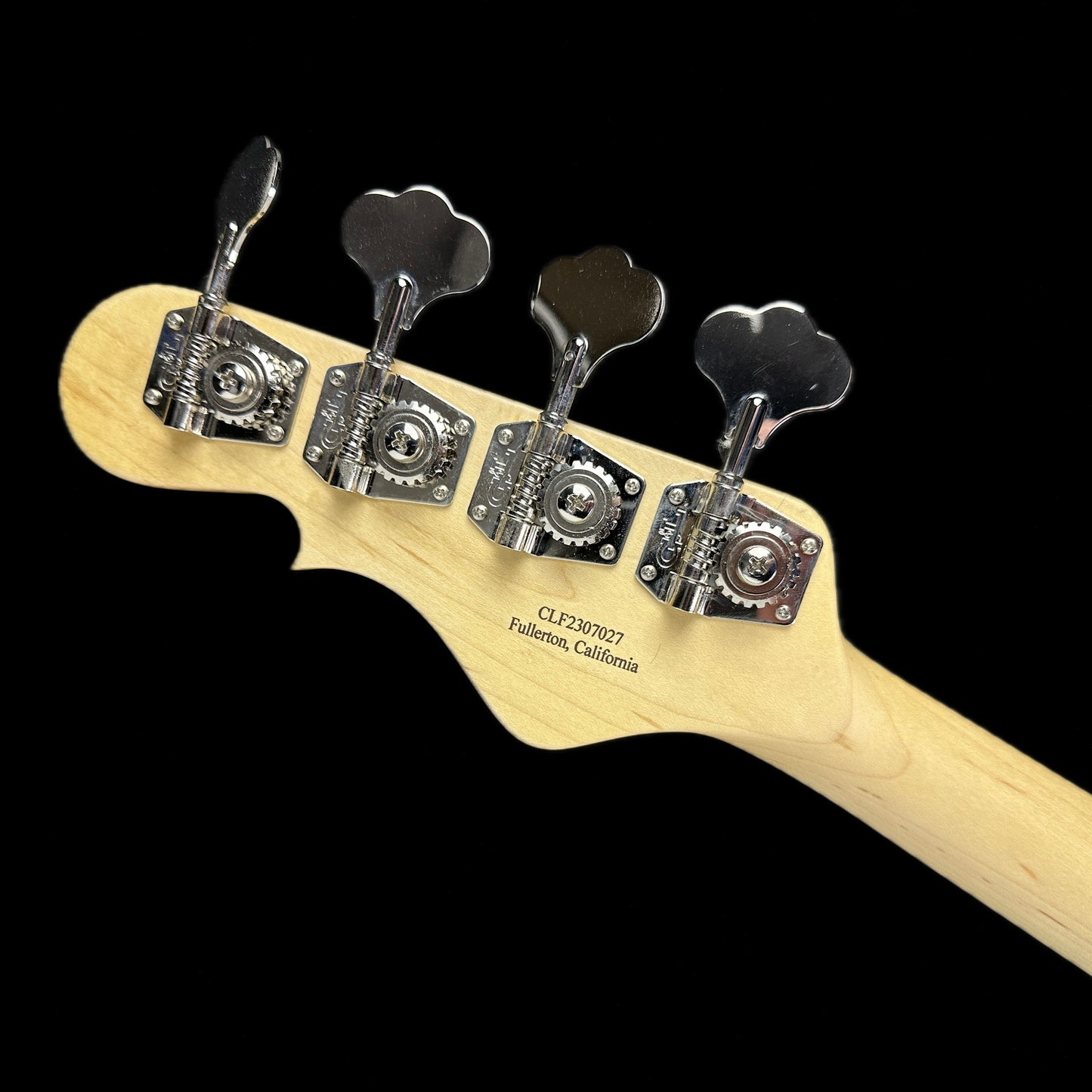 Back of headstock of G&L USA JB Jazz Bass Graphite Metallic.