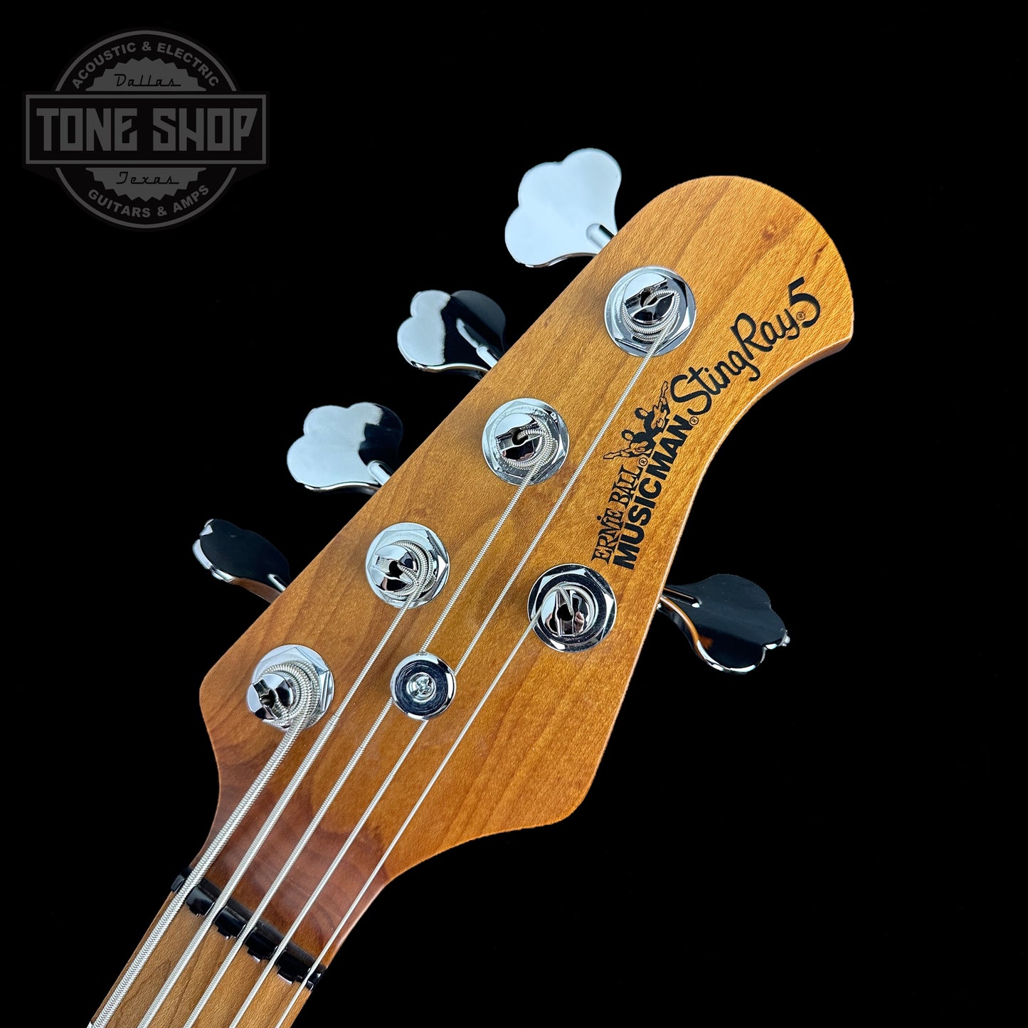 Front of headstock of Ernie Ball Music Man StingRay Special 5 HH Bass Hot Honey MP.