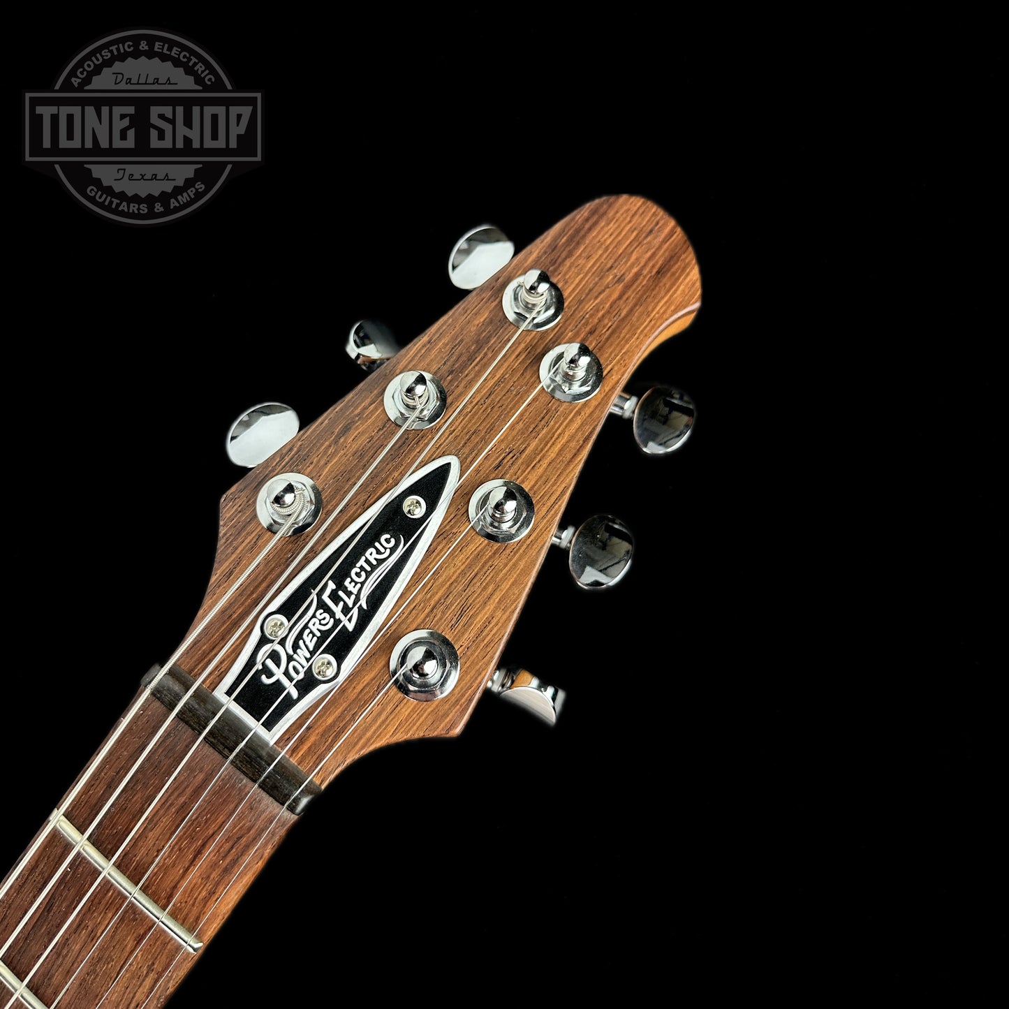 Front of headstock of Powers Electric A-Type Desert Dawn PF42 Pearl Ebony Warm CamTail.
