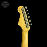 Guitar headstock with tuning pegs on a black background, featuring the Tone Shop logo.