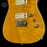 Close-up of a guitar's body with visible hardware on a black background