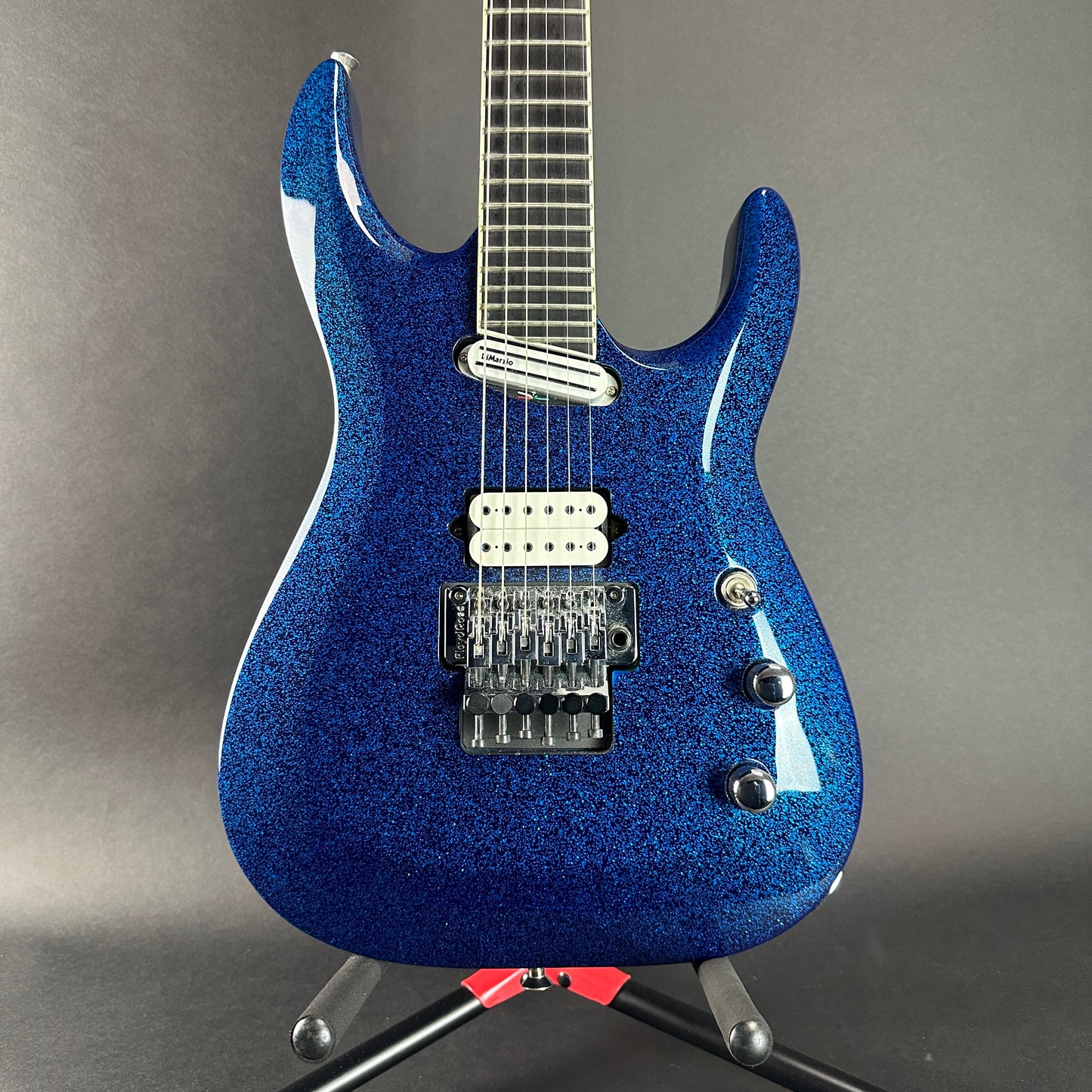 Front of Used Jackson LTD Wildwood Series Soloist Arch Top Extreme SL27 EX Blue Sparkle.