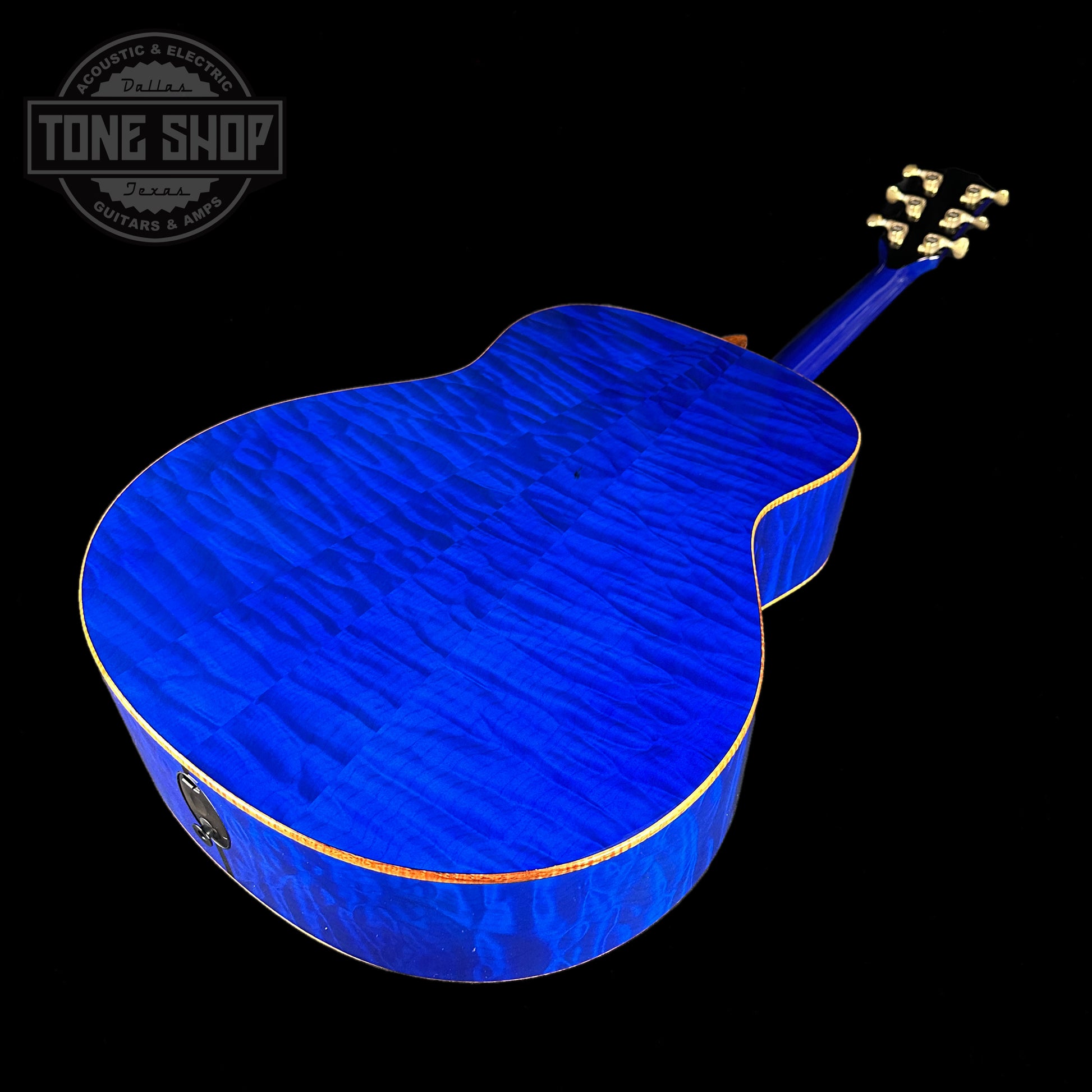 Back angle of Taylor Custom #3: C18e Grand Orchestra Lutz Spruce/Quilted Maple Royal Blue.