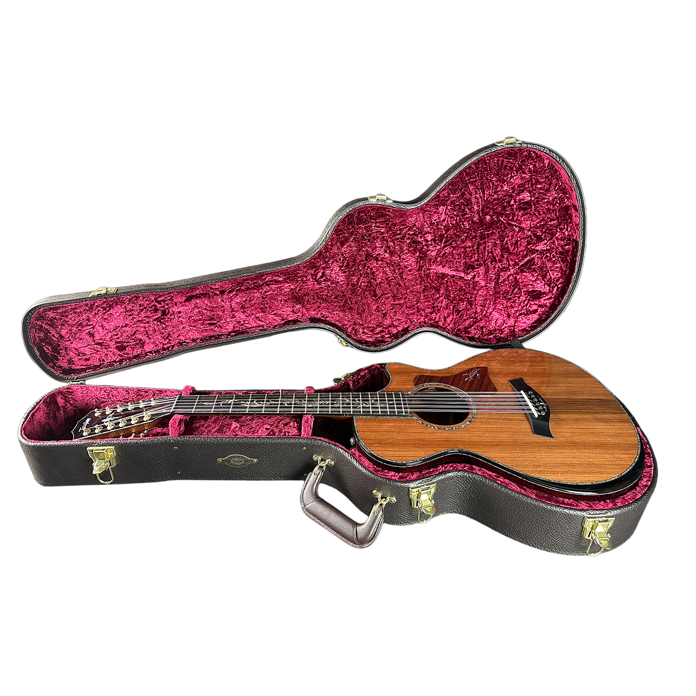 Acoustic guitar in a black case with pink interior on a white background