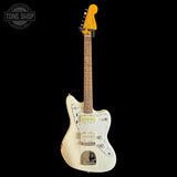 Squier Classic Vibe 60s Jazzmaster Oly White electric guitar with a yellow pickguard on a black background, featuring 'Tone Shop' branding.