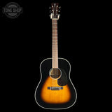Acoustic guitar with a black and brown finish on a white background