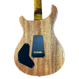 Wooden electric guitar body with a blue pickguard on a white background