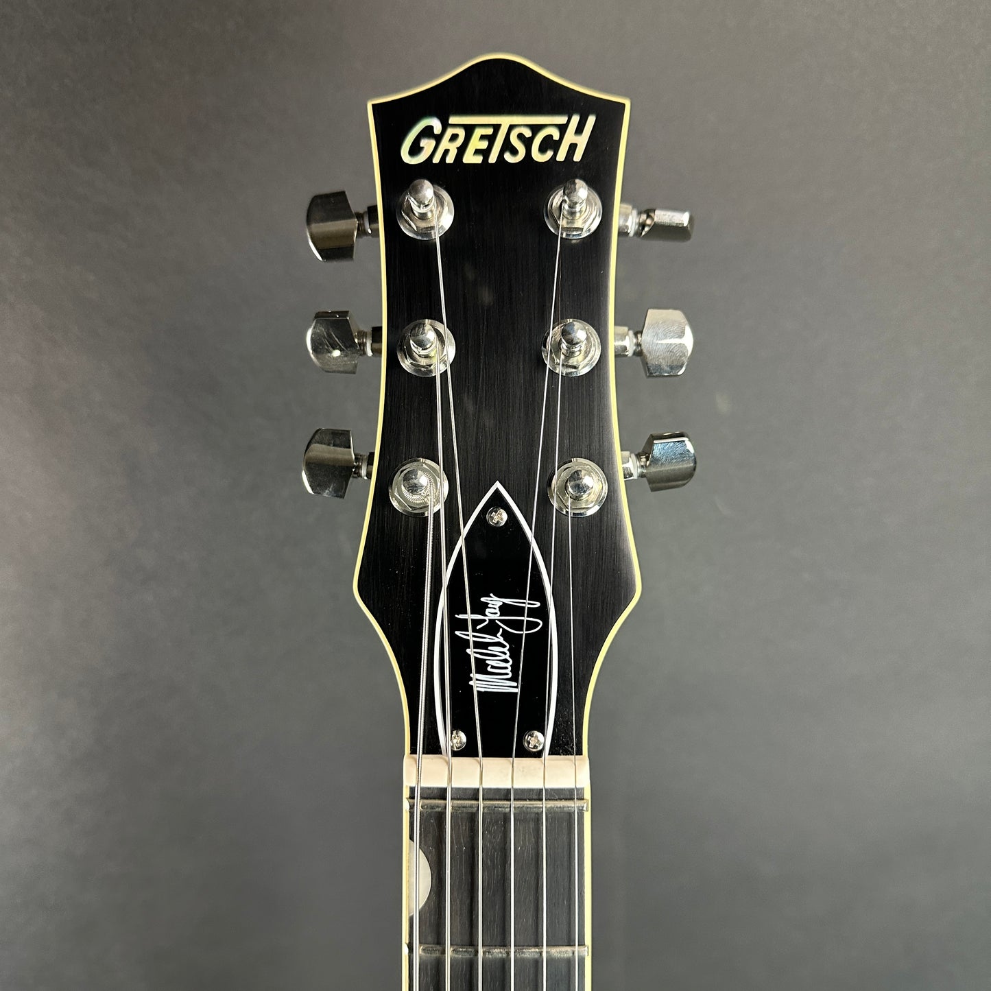 Front of headstock of Used Gretsch G6131T-MY Malcolm Young Signature Jet Ebony Fingerboard Natural.