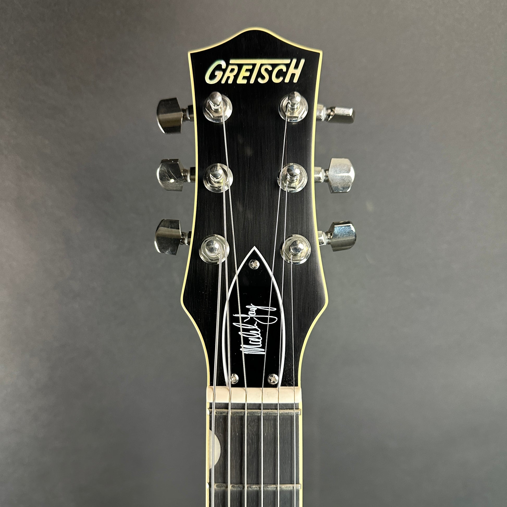 Front of headstock of Used Gretsch G6131T-MY Malcolm Young Signature Jet Ebony Fingerboard Natural.