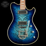 Blue electric guitar with a black background