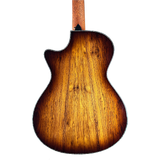 Back view of a wooden acoustic guitar on a white background