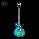 Blue electric guitar on a black background with 'Tone Shop' logo.