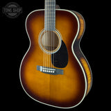 Front angle of Martin Custom Shop 28 Style OM Adirondack/Pacific Big Leaf Flamed Maple Ambertone.
