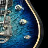 Close-up of a blue electric guitar's headstock and tuning pegs on a black background