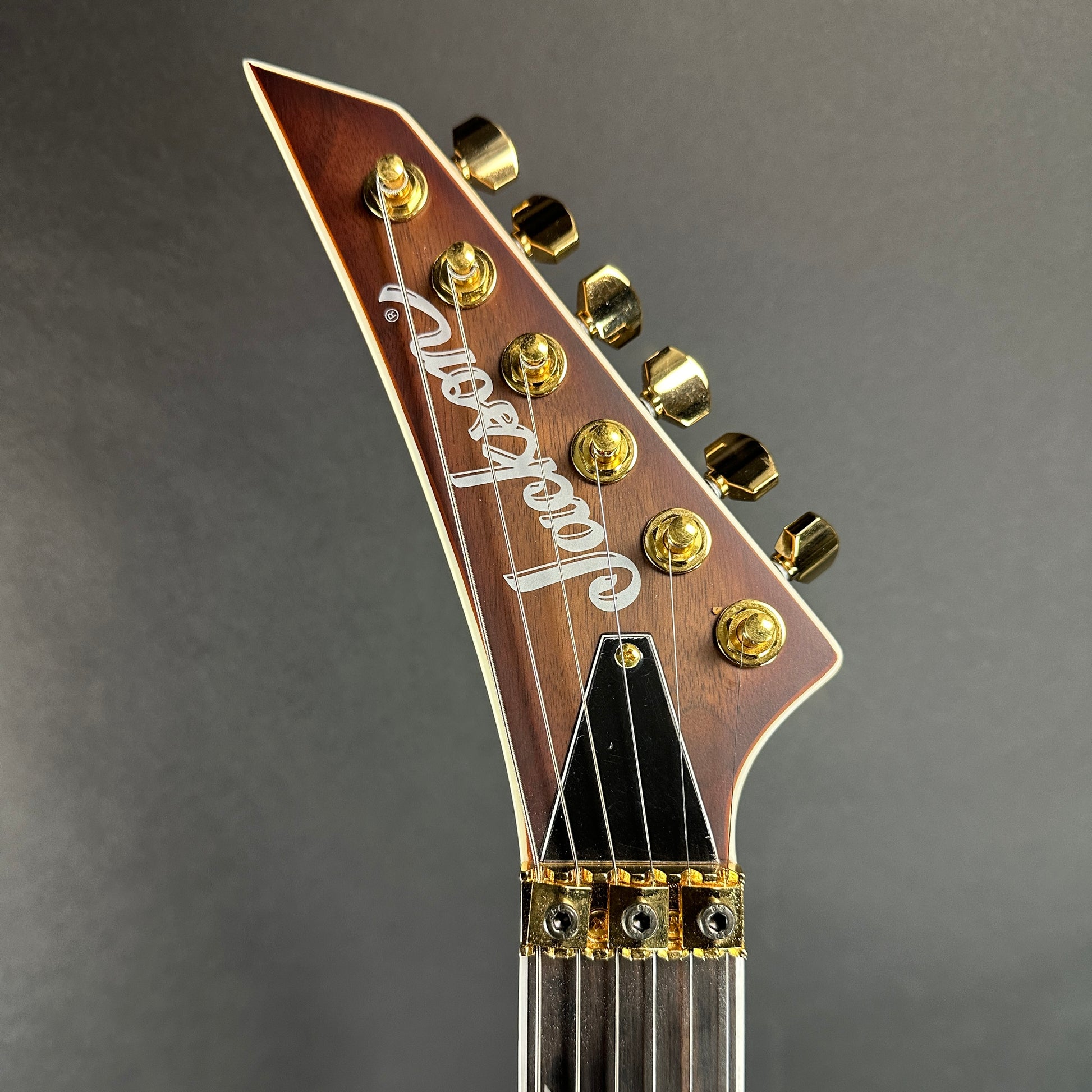 Front of headstock of Used Jackson Concept Series Soloist SL Walnut HS.