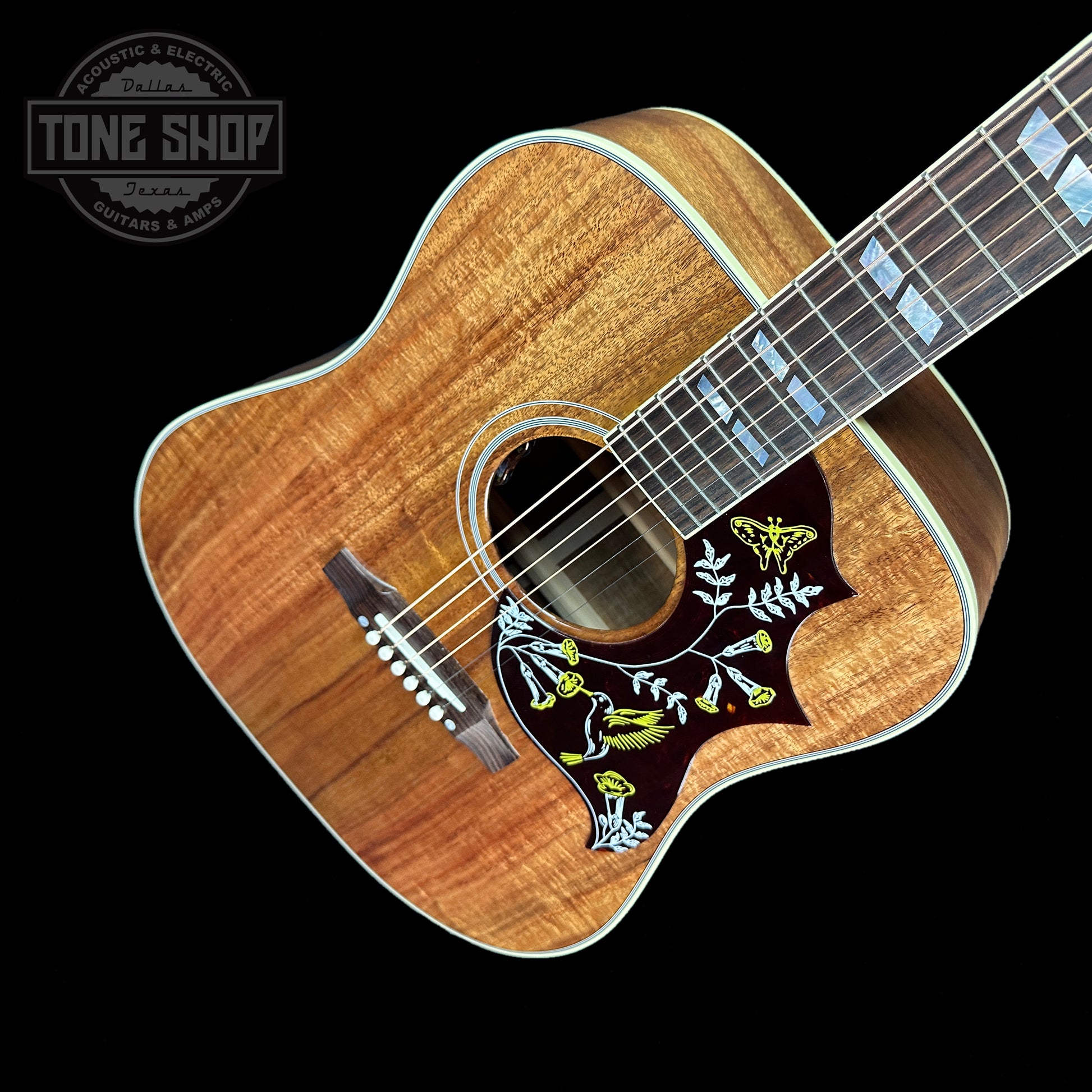 Front angle of Gibson Custom Shop M2M All Koa Hummingbird Gold Hardware Grover Tulips.
