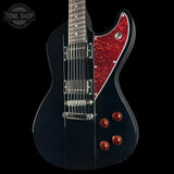 Black electric guitar with red pickguard and flame maple top on a black background, featuring 'Tone Shop' logo.