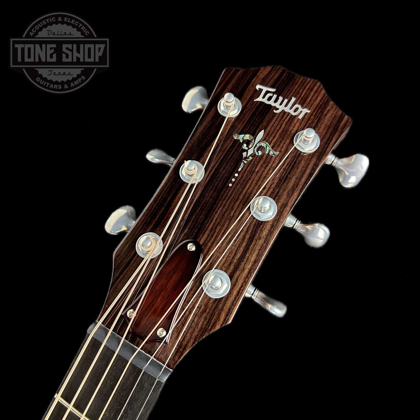 Front of headstock of Taylor Custom Catch #25 Grand Auditorium Western Red Cedar/East Indian Rosewood.