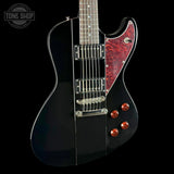 Black electric guitar with red pickguard on a black background, featuring 'Tone Shop' logo.