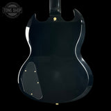 Black electric guitar body with 'Tone Shop' logo in the corner