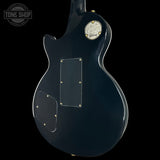 Gibson electric guitar back view with 'Tone Shop' logo.