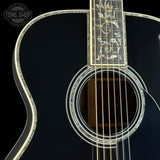 Front angle of Martin Custom Shop 45 Style OM Tree of Life Black.