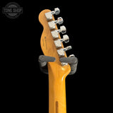Guitar headstock with tuning pegs on a black background, featuring the Tone Shop logo.
