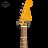 Squier J Mascis Jazzmaster Olympic White neck with headstock on a black background, featuring Squier branding.