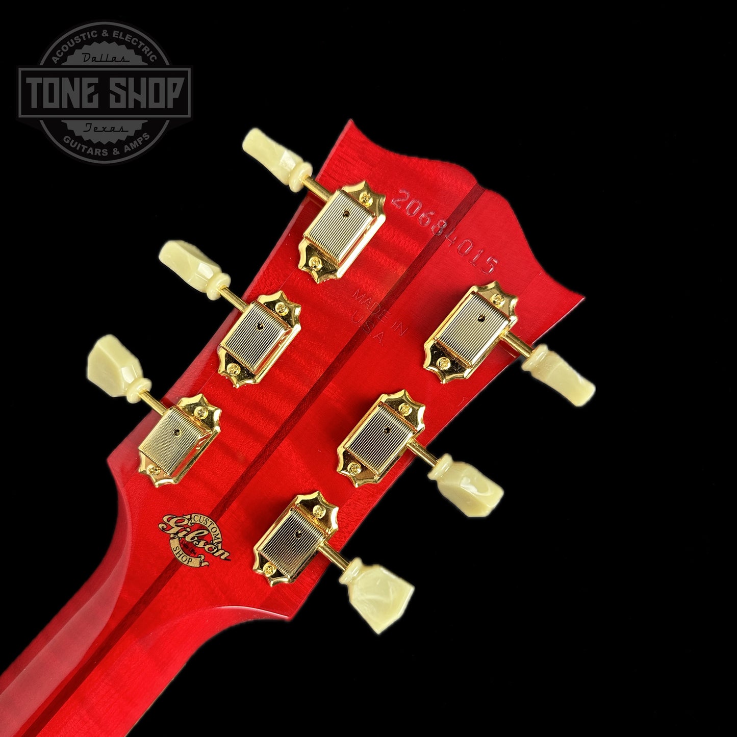 Back of headstock of Gibson Custom Shop M2M SJ-200 Original Cherry Quilt back and sides.
