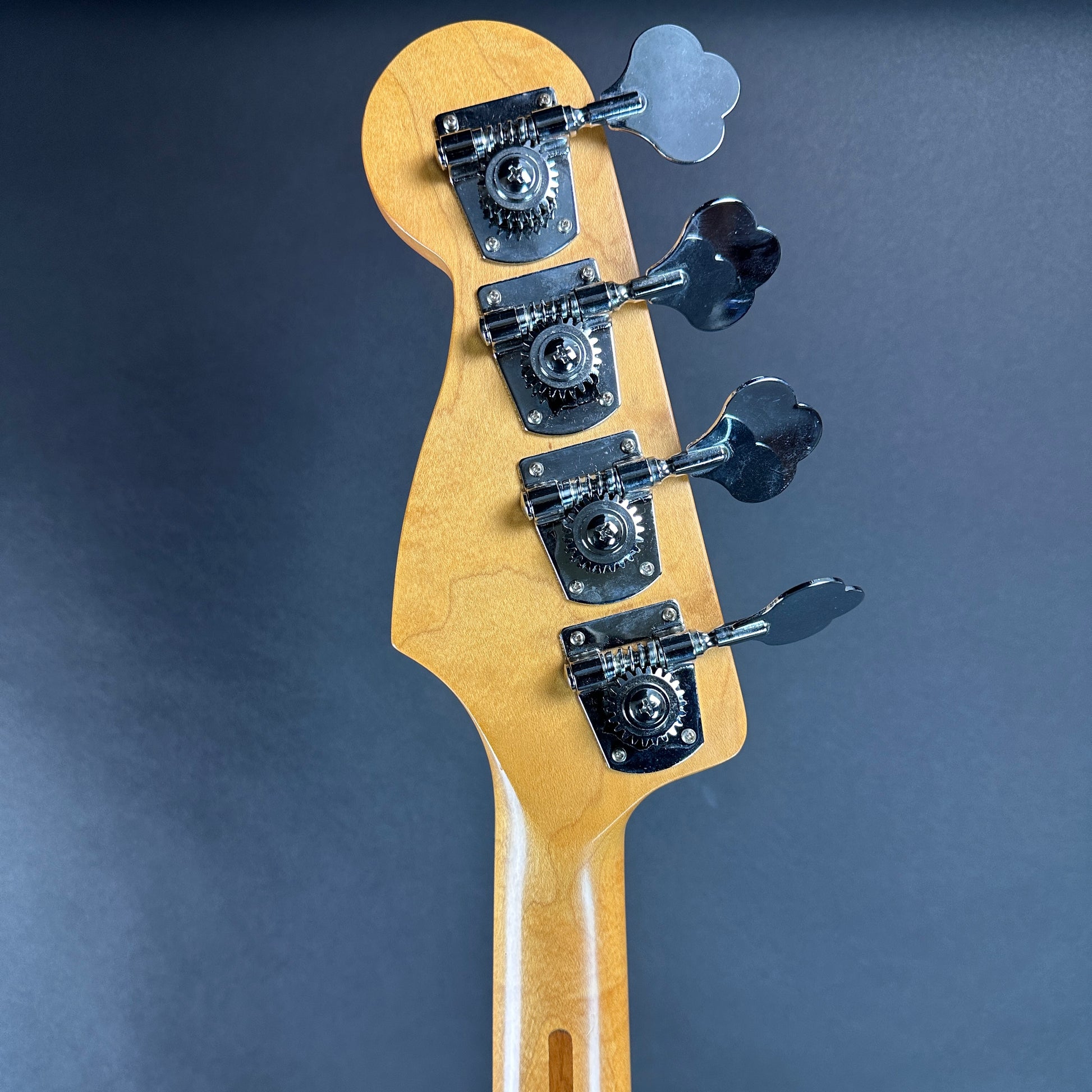 Back of headstock of Used Fender Jazz Bass MIM Sunburst.
