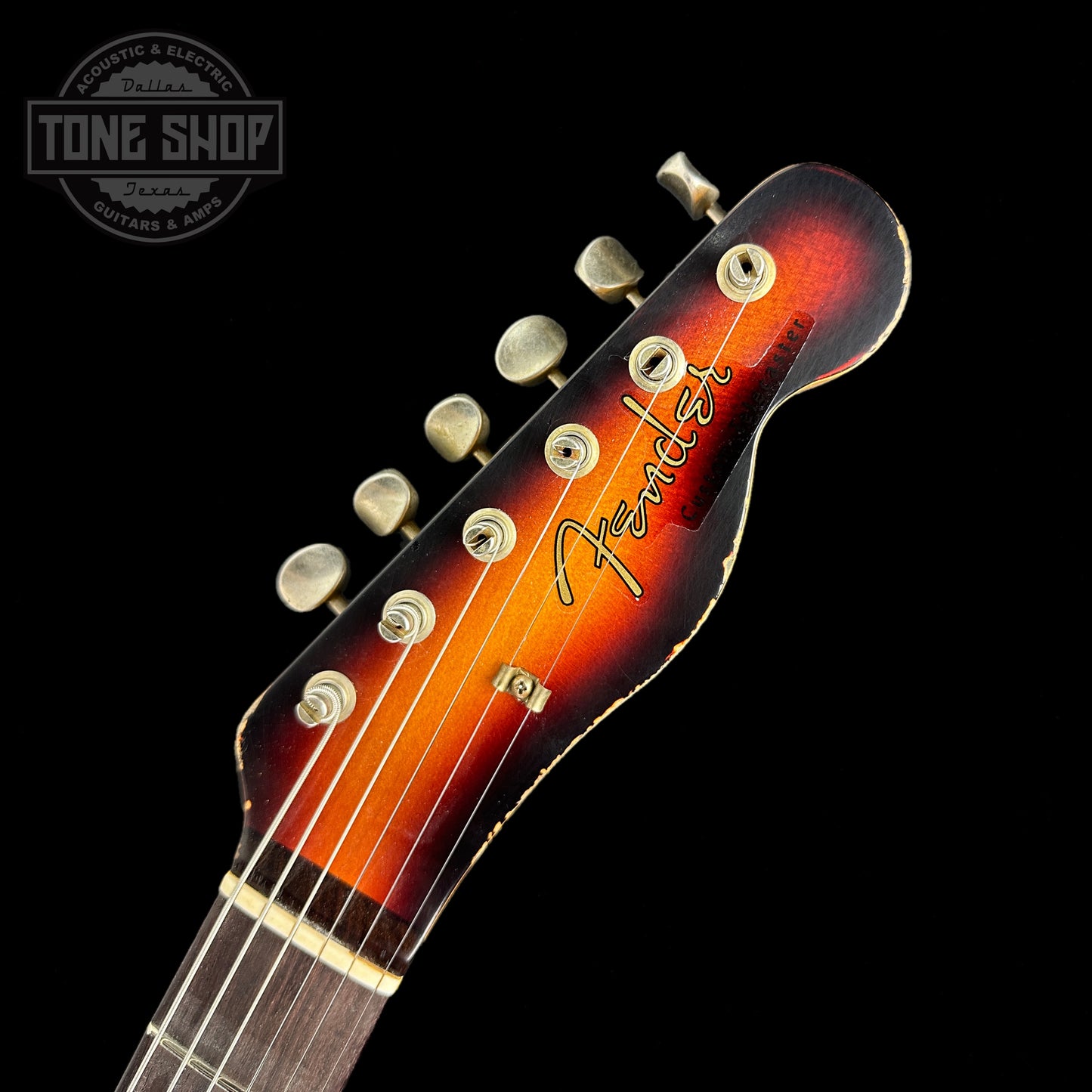 Front of headstock of Fender Custom Shop Limited Edition Reverse 60 Tele Custom Heavy Relic 3 Color Sunburst.