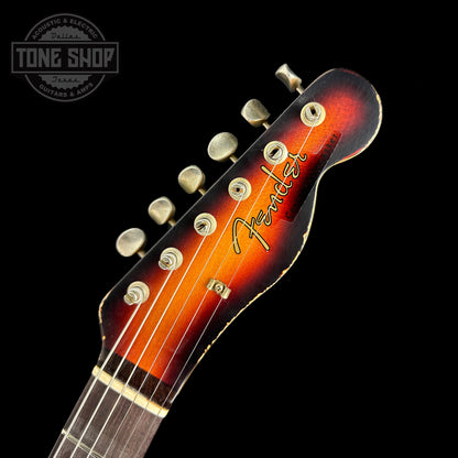 Front of headstock of Fender Custom Shop Limited Edition Reverse 60 Tele Custom Heavy Relic 3 Color Sunburst.