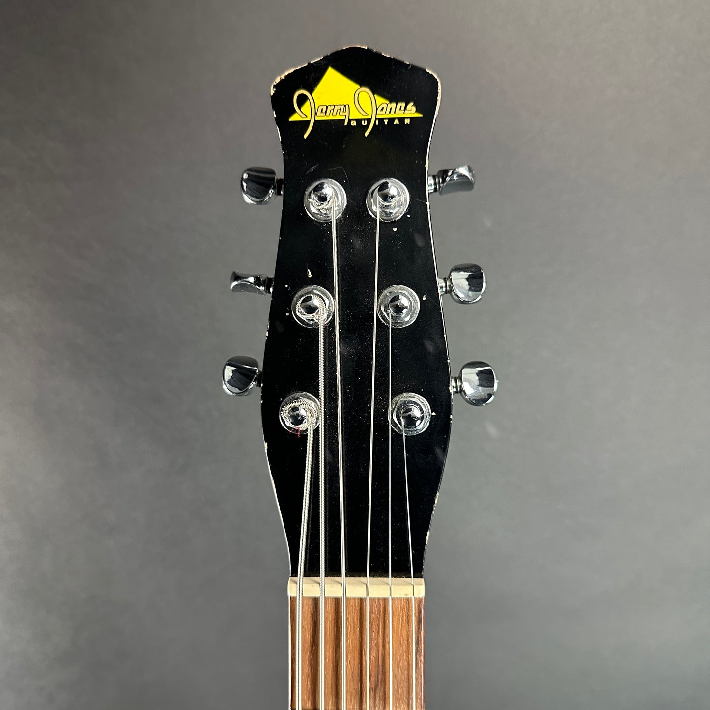 Front of headstock of Used Jerry Jones Shorthorn Baritone Black.