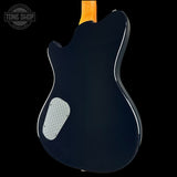 Back view of a blue electric guitar with a visible brand logo in the corner.