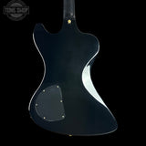 Black electric guitar body with 'Tone Shop' logo in the corner