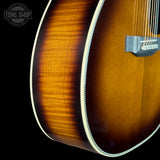 Front angle of Martin Custom Shop 28 Style OM Adirondack/Pacific Big Leaf Flamed Maple Ambertone.