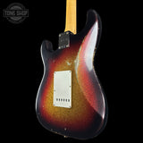 Electric guitar body with a sunburst finish on a black background, featuring the Tone Shop logo.