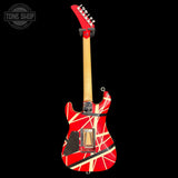 Red and white electric guitar with a distinctive pattern on a black background, featuring the 'Tone Shop' logo.