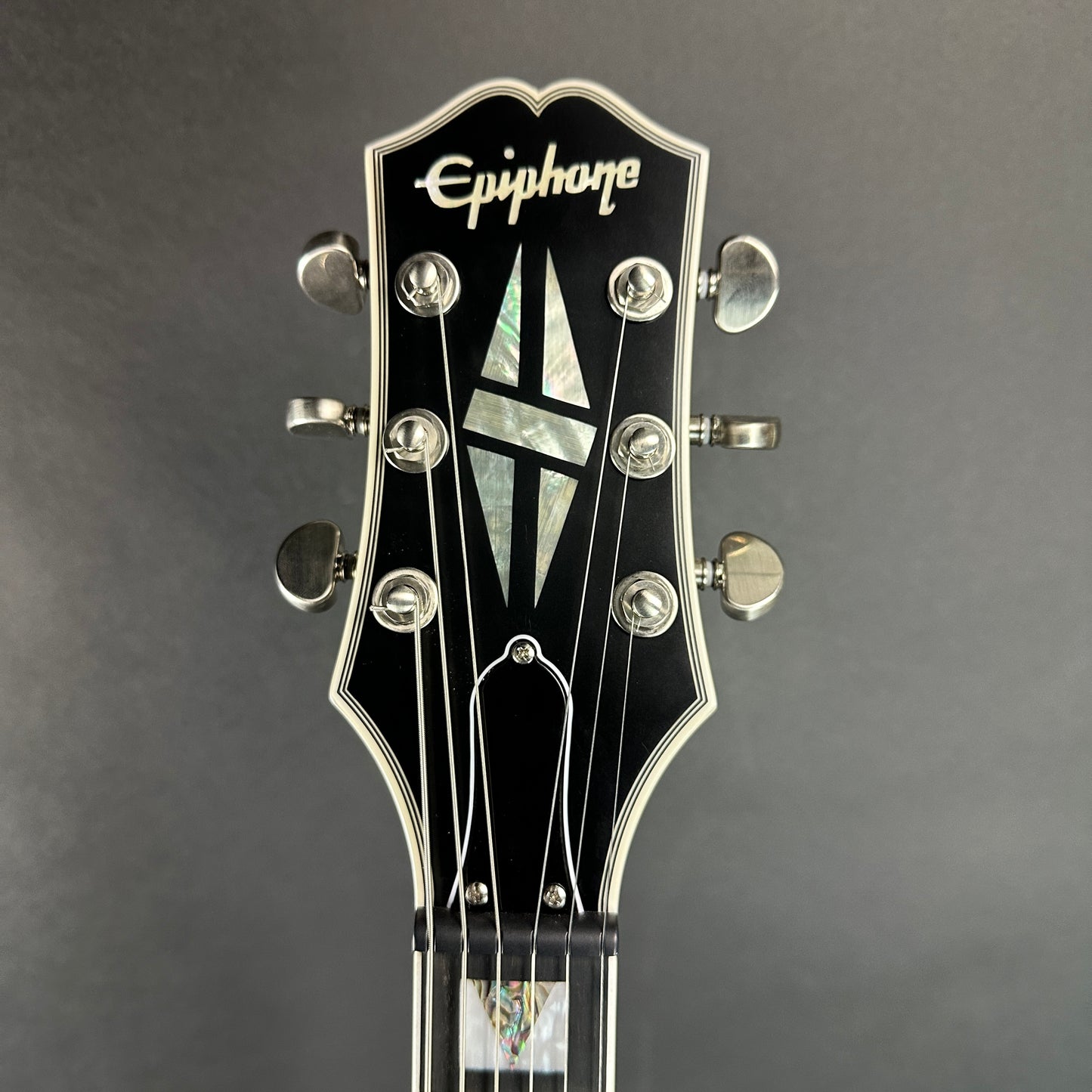Front of headstock of Used Epiphone SG Prophecy Red Tiger.