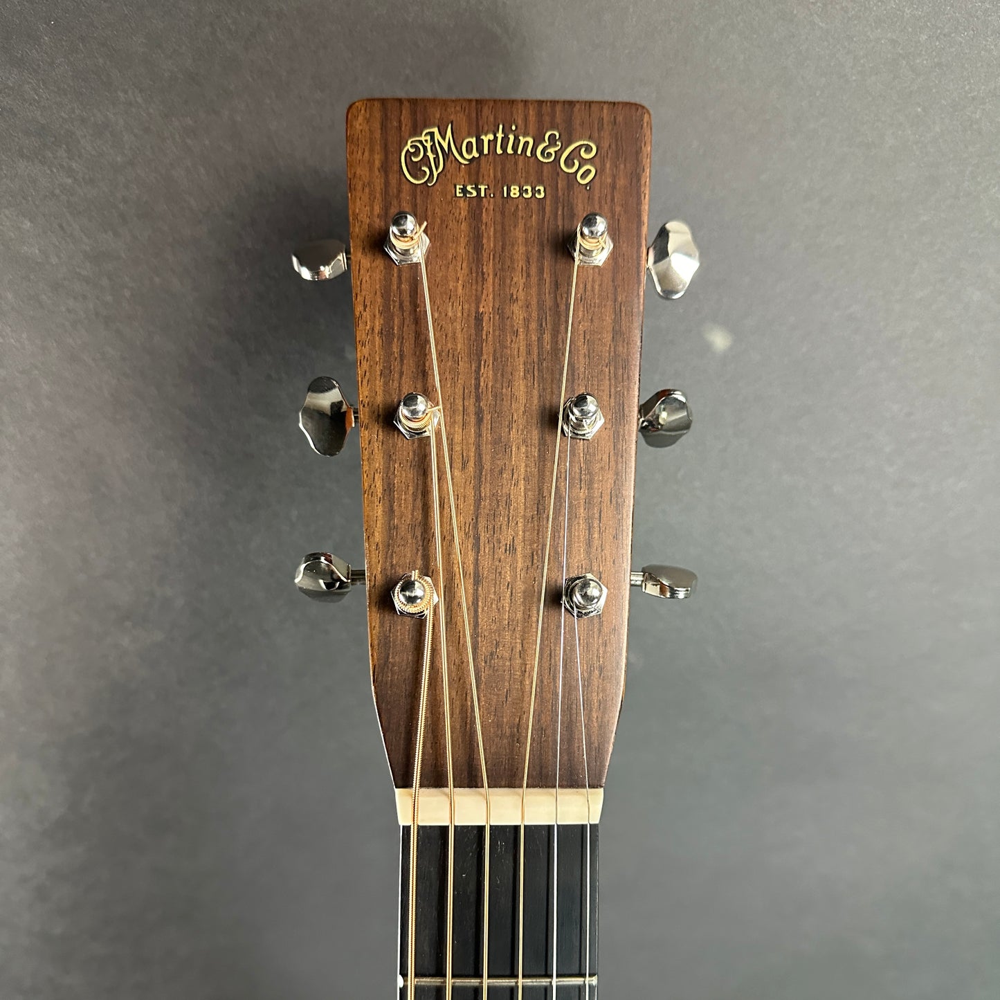 Front of headstock of Used Martin HD-28 Special Natural.