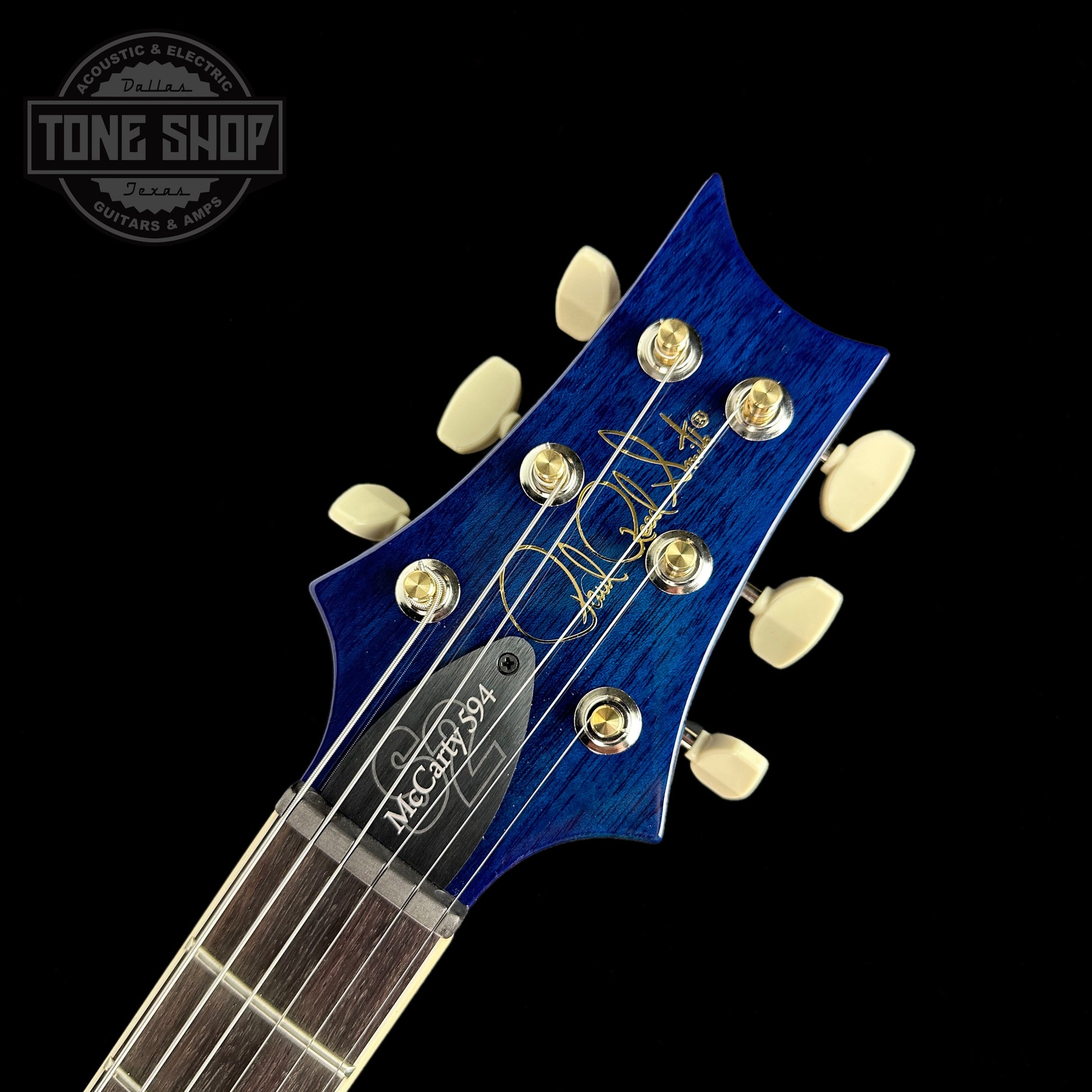Front of headstock of PRS S2 McCarty 594 Flame Top Makena Blue.