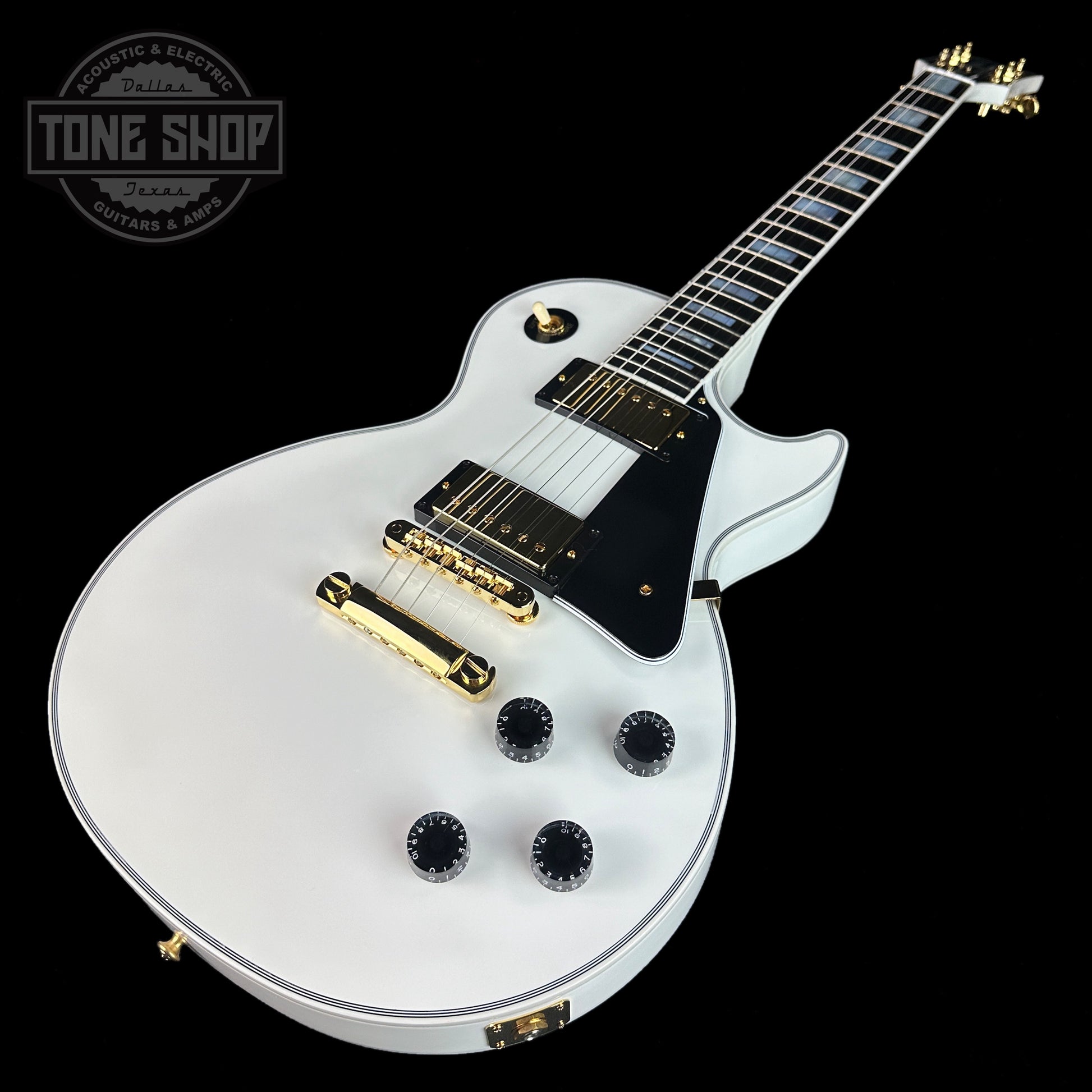 Front angle of Gibson Custom Shop Les Paul Custom Alpine White w/ Ebony Fingerboard Gloss.