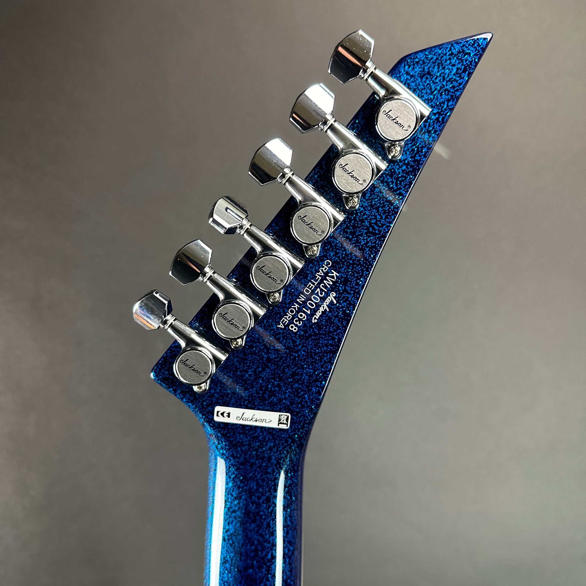 Back of headstock of Used Jackson LTD Wildwood Series Soloist Arch Top Extreme SL27 EX Blue Sparkle.