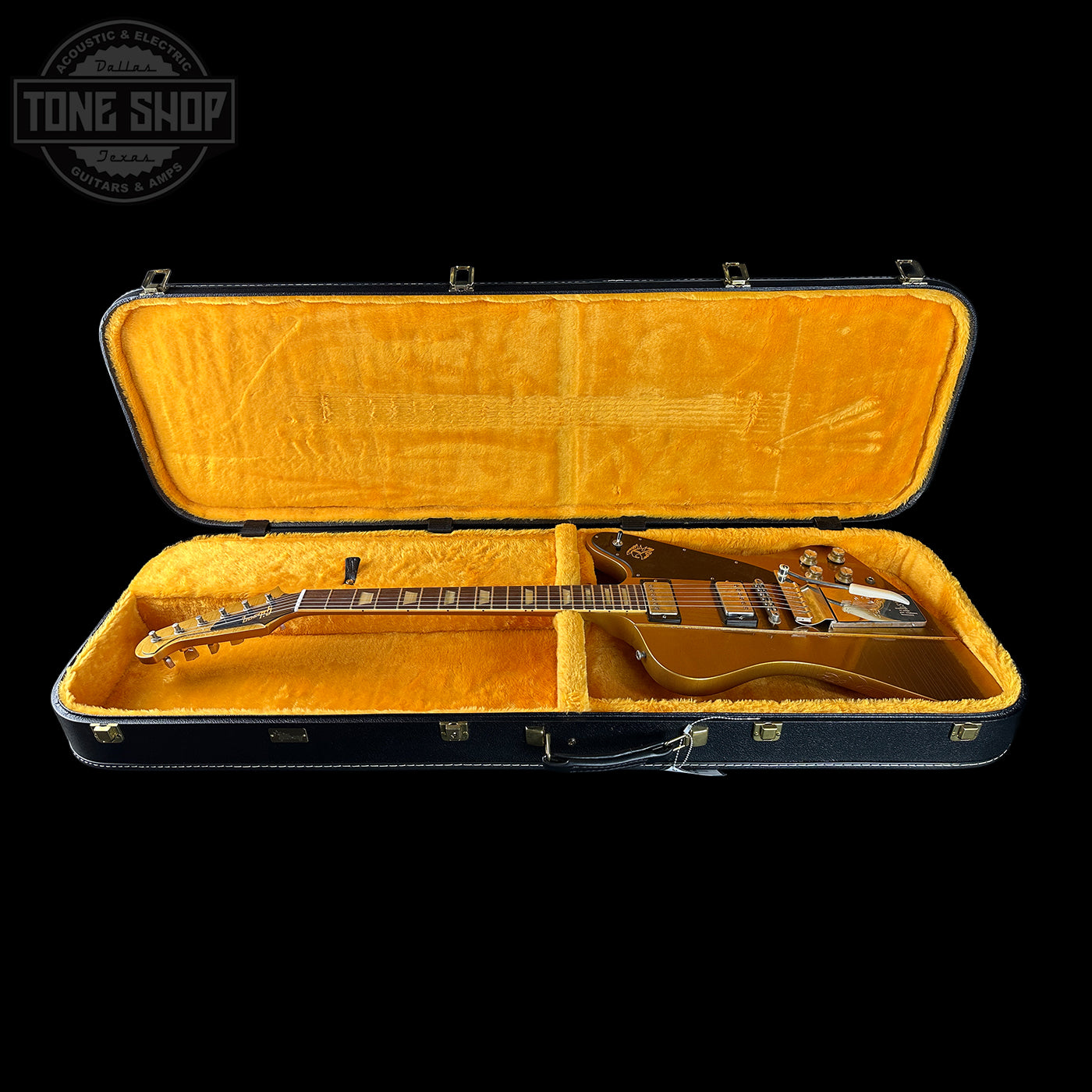 Guitar case with a guitar inside, branded 'Tone Shop'.