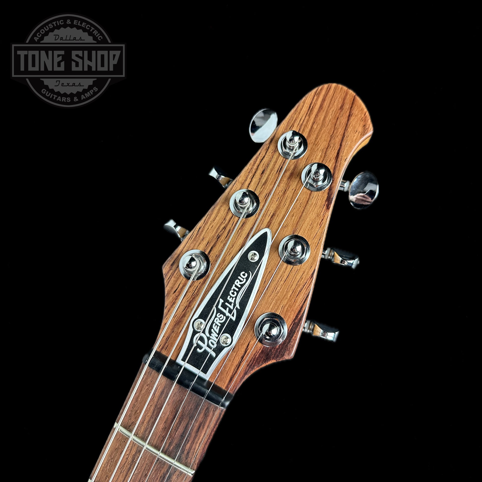 Front of headstock of Powers Electric A-Type Select Quilt Top Wild Cabernet Pearloid Pickguard FF42.