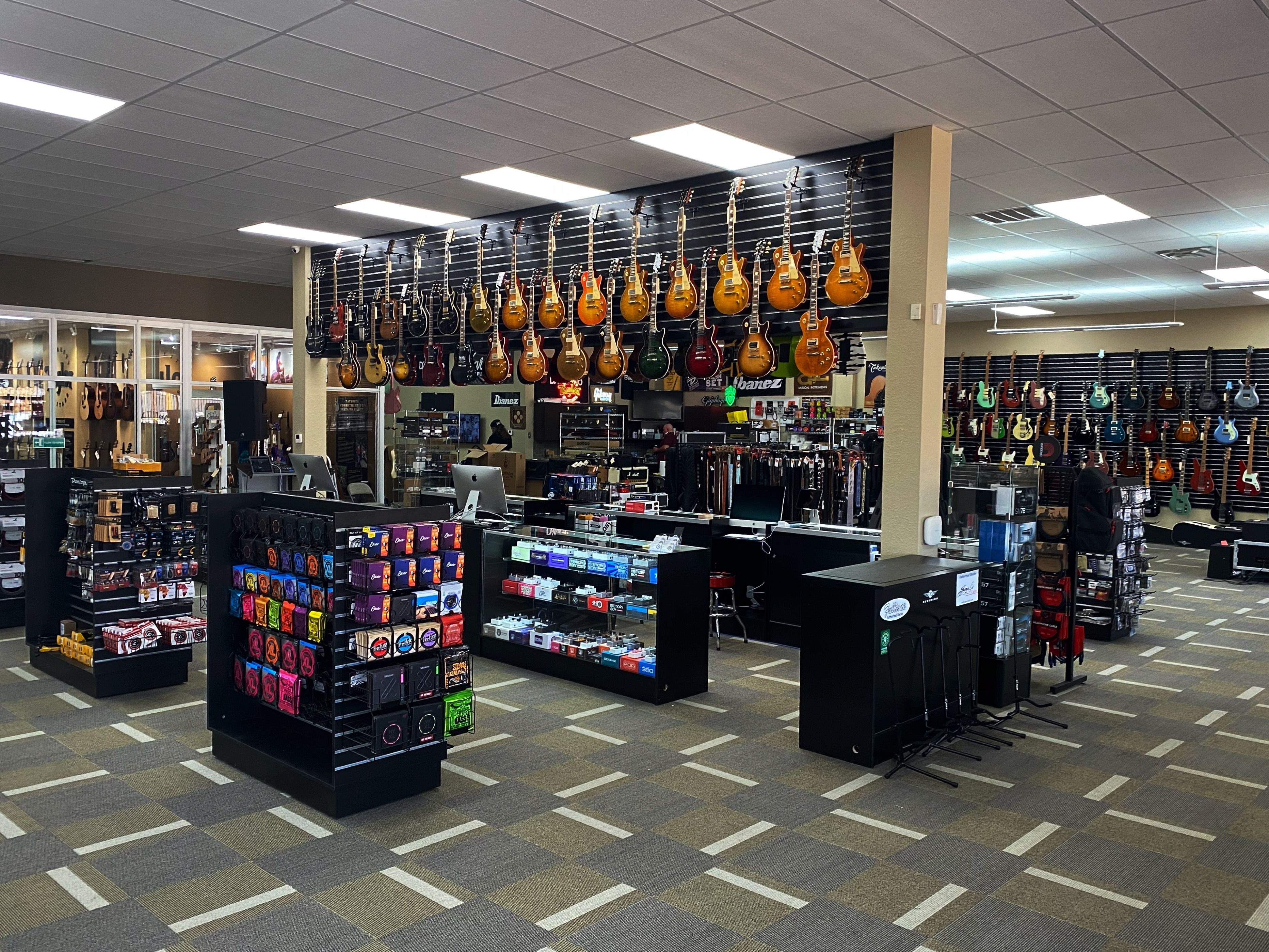 Our Addison location interior with our Taylor room, Gibson wall, and pedal displays. 