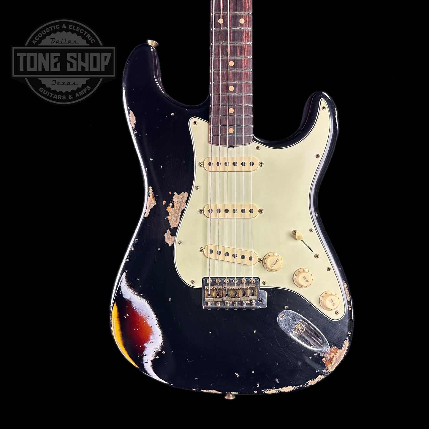 Front of body of Fender Custom Shop 2023 Collection 60 Strat Heavy Relic Aged Black Over 3 Color Sunburst.