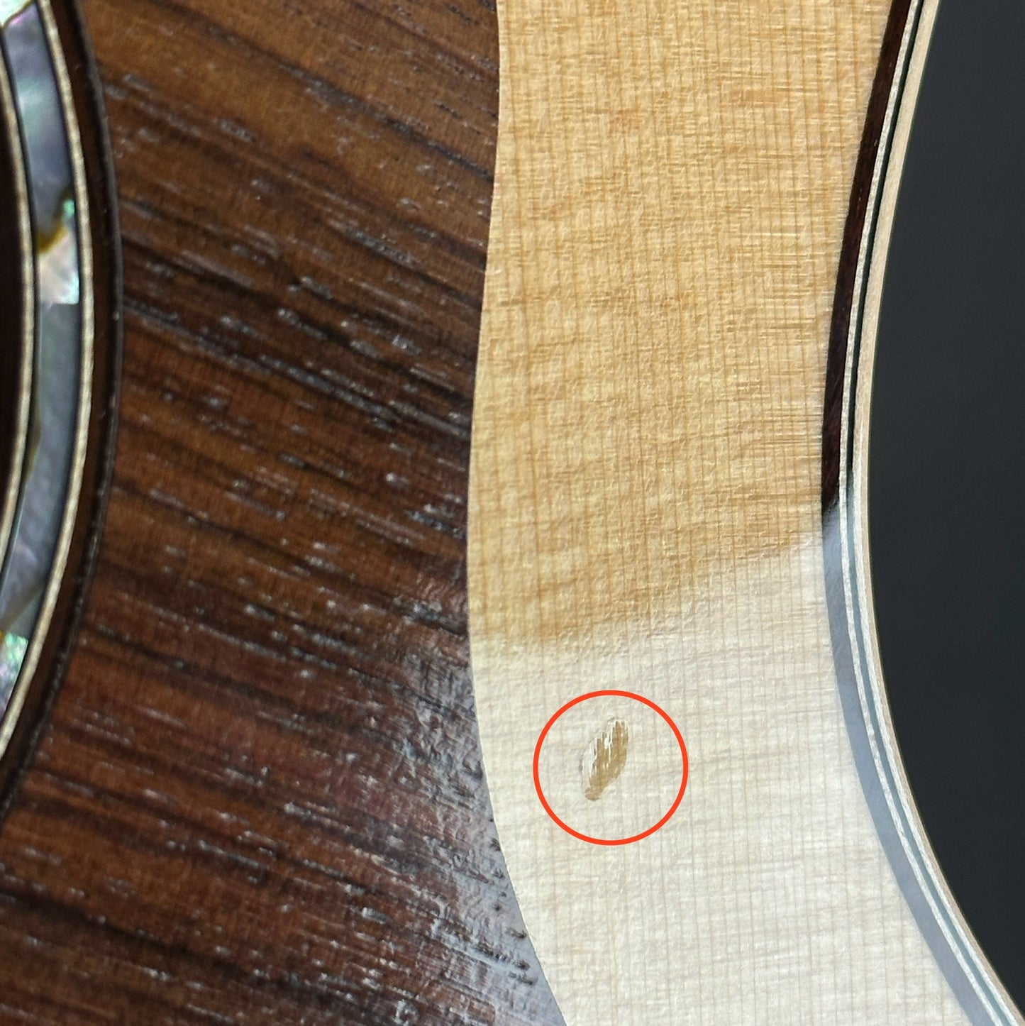 Ding near pickguard of Used 2022 Taylor 814ce V-Class.